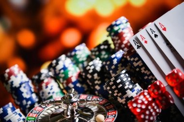 Live roulette table with card deck and chips in multi-camera studio